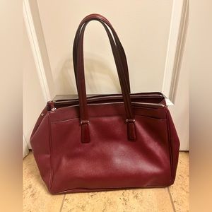 Tumi purple briefcase. Good condition.